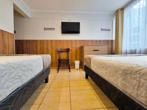 Postel nebo postele na pokoji v ubytování Hotel Intillanka