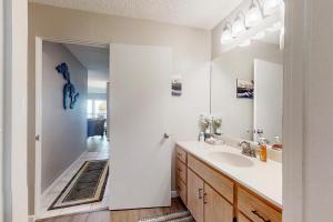 a bathroom with a sink and a mirror at Ridge Top 21 22 in Glen Arbor +19 photos