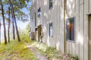 a building with a dirt road next to it at Ridge Top 21 22 in Glen Arbor