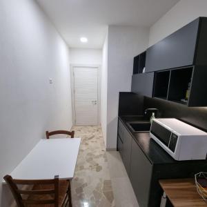 Kuchyň nebo kuchyňský kout v ubytování Attico Indipendente nel Cuore di Modena