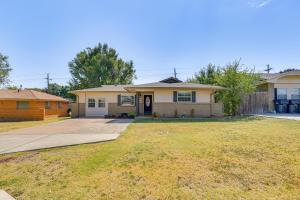 a house with a driveway and a yard at 4 Mi to Museum of the Great Plains Lawton Home! in Lawton