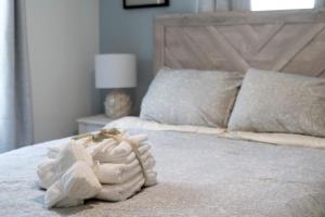 a bedroom with a bed with a white towel on it at Delightful Getaway near Acadia Park Bar Harbor (5) in Trenton