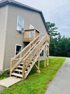 a deck on the side of a house at Delightful Getaway near Acadia Park Bar Harbor (5) in Trenton