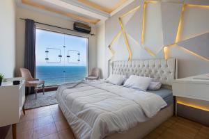 Ένα ή περισσότερα κρεβάτια σε δωμάτιο στο Hyat Suites & Rooms
