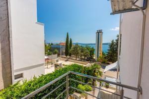 a balcony of a building with a view of a street at Melanie in Crikvenica