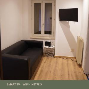 TV a/nebo společenská místnost v ubytování Room45 appartamento in centro a Gradisca