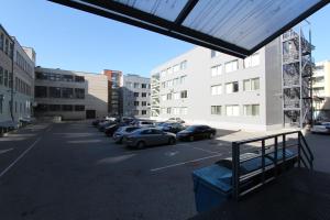 a view of a parking lot with cars parked at IBIS Styles Kaunas Centre in Kaunas