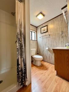 a bathroom with a toilet and a sink at Hidden Lake Campground and Resort in Hot Springs