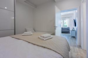 En eller flere senge i et værelse på Palace Paulina 1B + 70 billeder