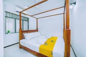 Postel nebo postele na pokoji v ubytování Shinestar Villa Mirissa