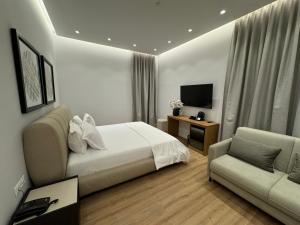 TV a/nebo společenská místnost v ubytování Hotel Vila Zeus
