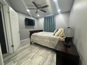 a bedroom with a bed and a ceiling fan at Willow Ridge Cove in West Monroe