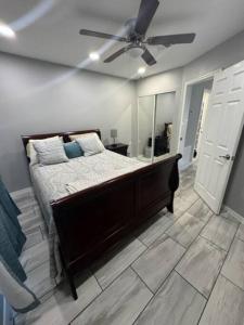 a bedroom with a bed and a ceiling fan at Willow Ridge Cove in West Monroe