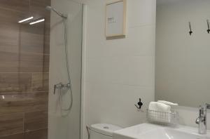 a bathroom with a shower and a toilet and a sink at Vivienda Uso Turistico Zapateria 1 licencia VUT 42120 in Soria