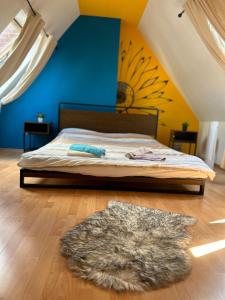 a bedroom with a bed and a rug on the floor at Piano Apartment Halle Center - Netflix- Free WiFi 3 in Halle an der Saale