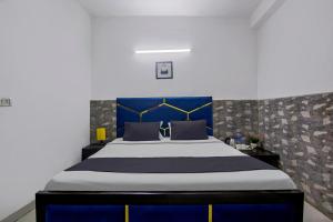 Postel nebo postele na pokoji v ubytování Hotel O Relax Inn + 22 fotografií