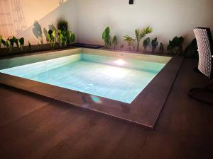 a large swimming pool in the middle of a room at Casa Kaan, Senderos, Mayakoba in Playa del Carmen