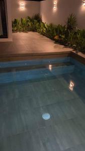 a swimming pool with lights in a house at Casa Kaan, Senderos, Mayakoba in Playa del Carmen +94 photos