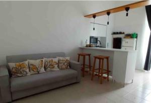 a living room with a couch and a kitchen at 19gradini in Putignano +14 photos