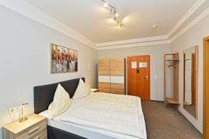 Postel nebo postele na pokoji v ubytování Hotel Haus Kleimann-Reuer