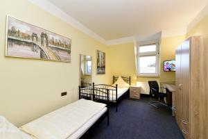 Postel nebo postele na pokoji v ubytování Hotel Haus Kleimann-Reuer