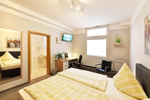 Postel nebo postele na pokoji v ubytování Hotel Haus Kleimann-Reuer