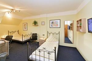 Postel nebo postele na pokoji v ubytování Hotel Haus Kleimann-Reuer