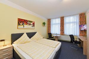 TV a/nebo společenská místnost v ubytování Hotel Haus Kleimann-Reuer