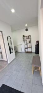 a large room with a chair and a table at Alex House in Făgăraş