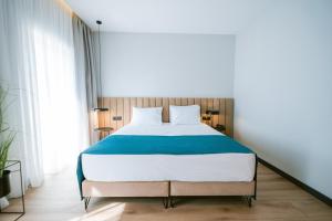 Ліжко або ліжка в номері TRIBUTE Hotel