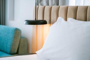 Ліжко або ліжка в номері TRIBUTE Hotel