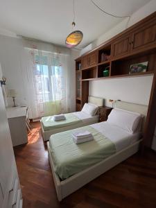 Ένα ή περισσότερα κρεβάτια σε δωμάτιο στο Lumà Apartment - Careggi