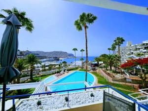 a view from the balcony of a resort with a swimming pool at Wonderful Ocean View in Playa del Cura