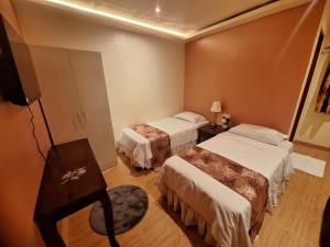 Postel nebo postele na pokoji v ubytování Irabella Travellers Inn