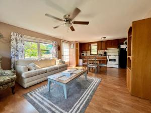 a living room with a couch and a table at Hidden Lake Campground and Resort in Hot Springs +74 photos
