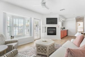a living room with a couch and a fireplace at Island Cottage Inn in Flagler Beach