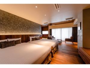 那覇市にあるPROSTYLE TERRACE NAHA - Vacation STAY 53661vの部屋にベッドが2つあるホテルの部屋