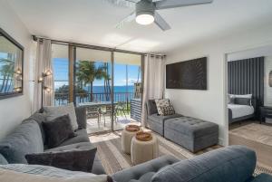 a living room with a view of the ocean at Chic Condo— Renovated & Refurnished 2023 / 2024 in Wailuku