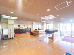 a large room with a lobby with tables and chairs at Sun Hotel Kokubu - Vacation STAY 62369v in Kirishima