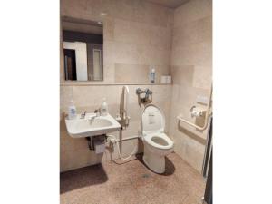 a bathroom with a toilet and a sink at Sun Hotel Kokubu - Vacation STAY 62369v in Kirishima +46 photos