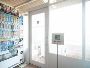 a store with a soda machine and a refrigerator at Sun Hotel Kokubu - Vacation STAY 62412v in Kirishima