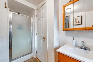 a bathroom with a shower and a sink at Grants Pass Cottage about 8 Mi to Rogue River! in Grants Pass +16 photos