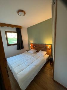 Postel nebo postele na pokoji v ubytování Pied de piste