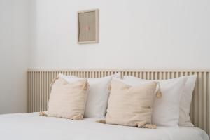 Nathan's Suites On The Beach客房内的一张或多张床位