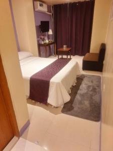 Postel nebo postele na pokoji v ubytování Irabella Travellers Inn