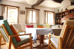 a dining room with a table and chairs at Chalupa Bílá Desná in Jablonec nad Nisou