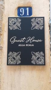 Ein Zertifikat, Auszeichnung, Logo oder anderes Dokument, das in der Unterkunft Guest House alla Scala ausgestellt ist