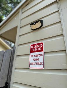 a sign on the side of a house at The Sanford Foodie Guest House in Sanford +3 photos