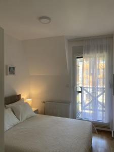Ένα ή περισσότερα κρεβάτια σε δωμάτιο στο Apartman DivčiMonte