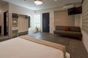 Postel nebo postele na pokoji v ubytování Aura Hotel B&B